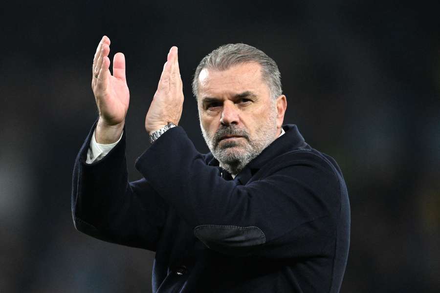 Tottenham manager Ange Postecoglou applauds the fans