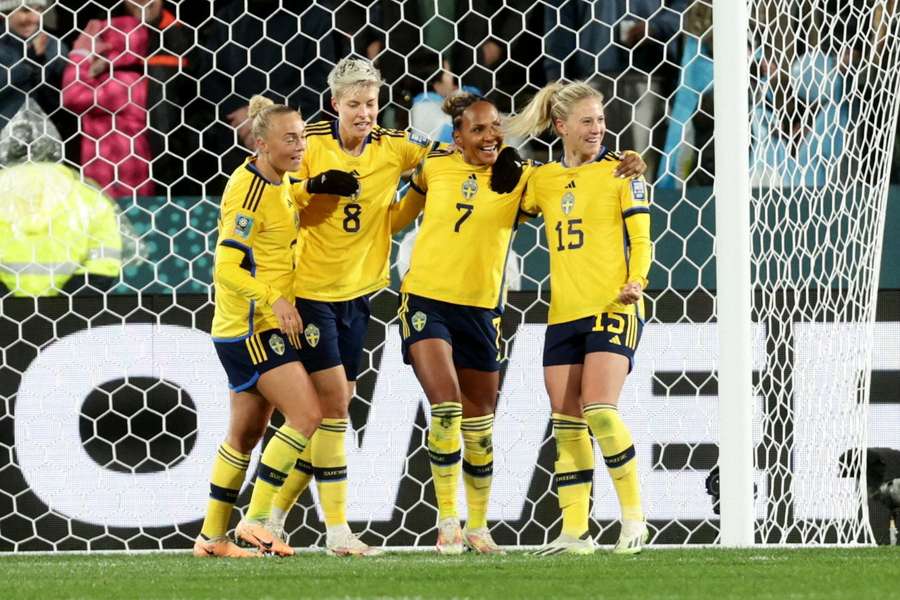 Sweden's players celebrate after scoring a goal earlier in the tournament