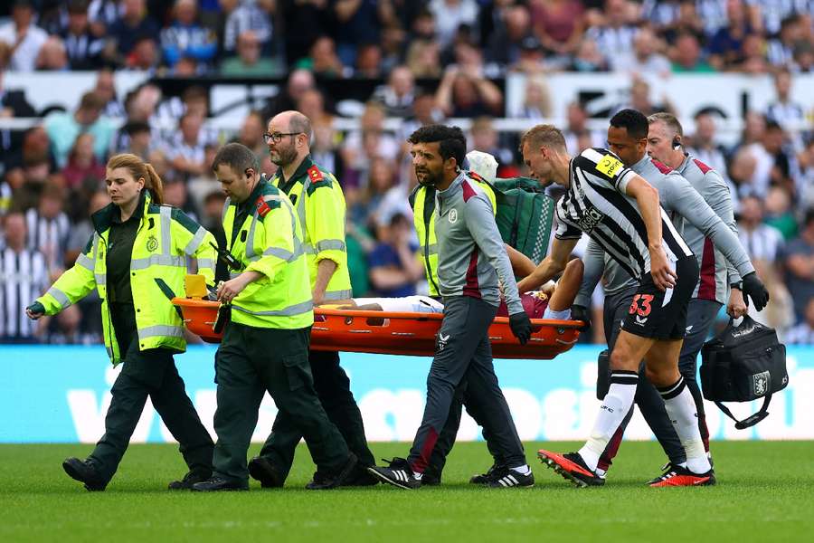 Mings was stretchered off in the first half