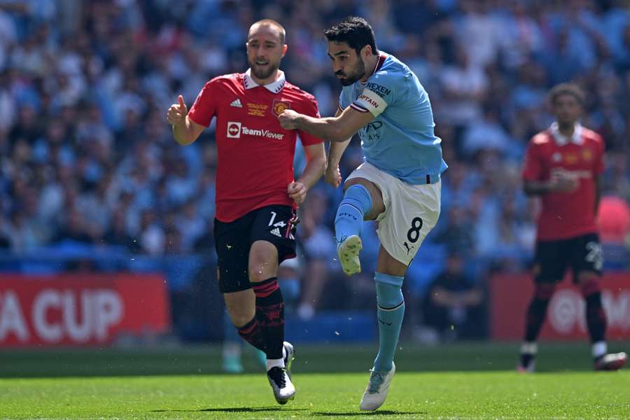 Manchester City midfielder Ilkay Gundogan shoots to score the early opening goal