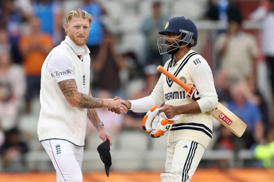 Ben Stokes (L) shakes hands with Ravindra Jadeja