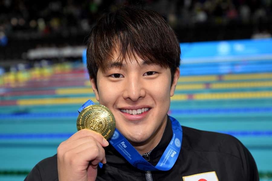 Seto poses with his gold medal