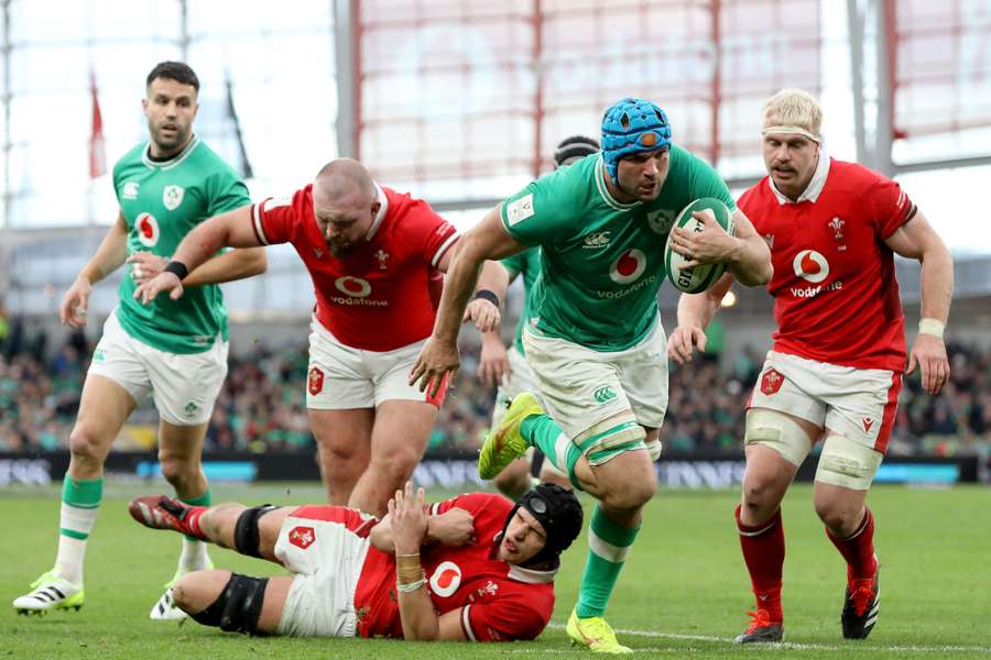 Ireland's lock Tadhg Beirne (C) runs in a try during the Six Nations international rugby union match between Ireland and Wales