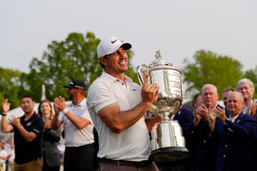 Brooks Koepka celebrates his fifth major title