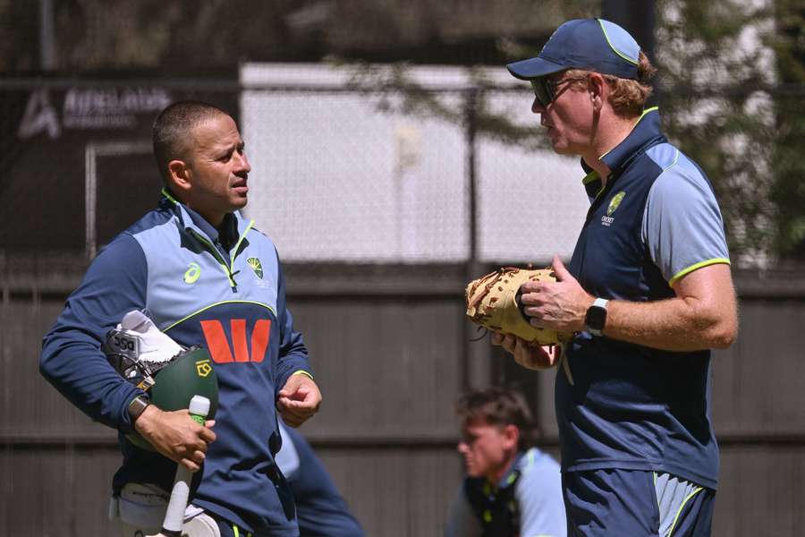 Usman Khawaja speaks with Australia head coach Andrew McDonald about his non-selection for Wednesday. Usman Khawaja speaks with Australia head coach Andrew McDonald about his non-selection for Wednesday.