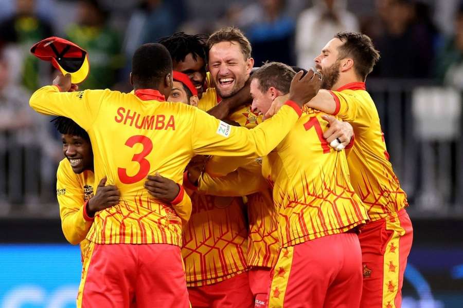 Zimbabwe's players celebrate their thrilling win in Perth.