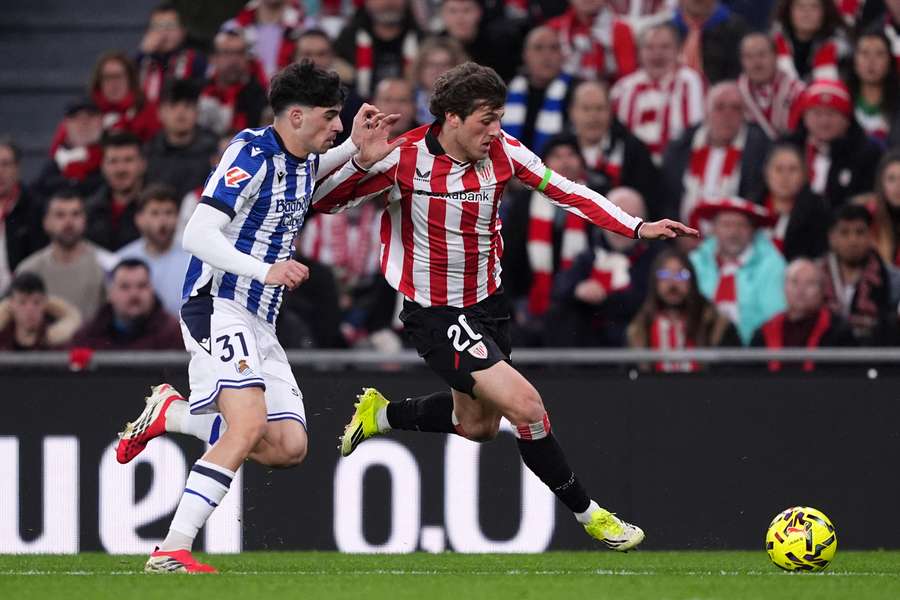 Unai Gomez of Athletic Club is challenged by Jon Martin of Real Sociedad