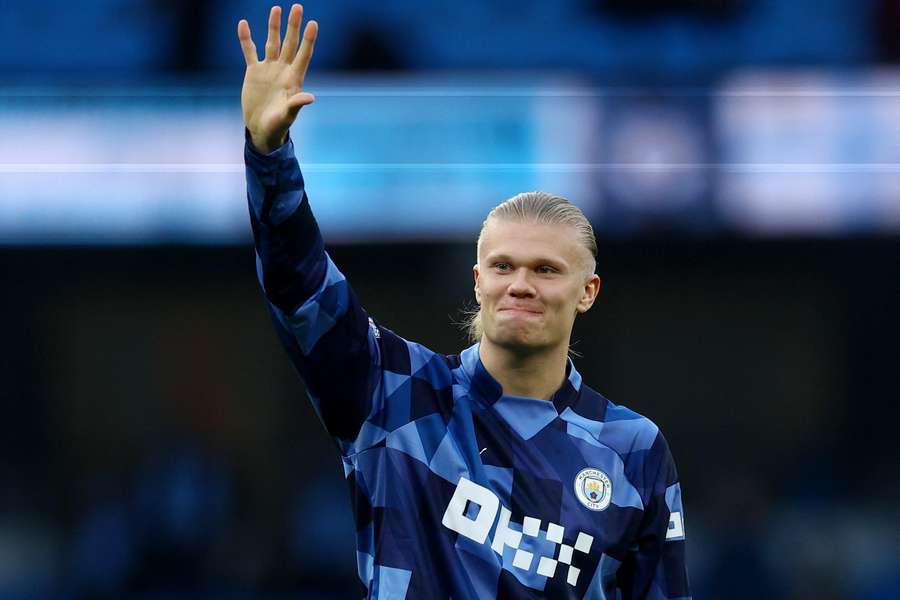Erling Haaland salutes the City supporters after the game