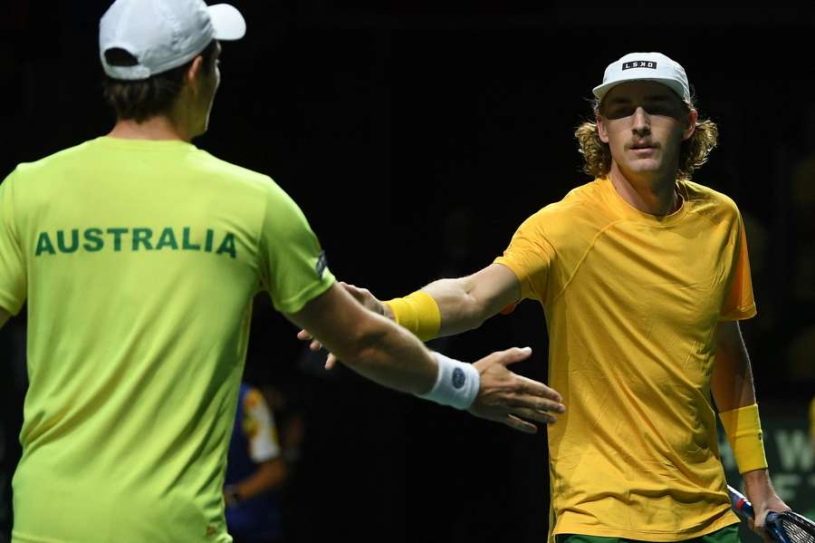 Australia's Max Purcell (R) and Australia's Matthew Ebden shake hands during the men's double quarter-final tennis match 