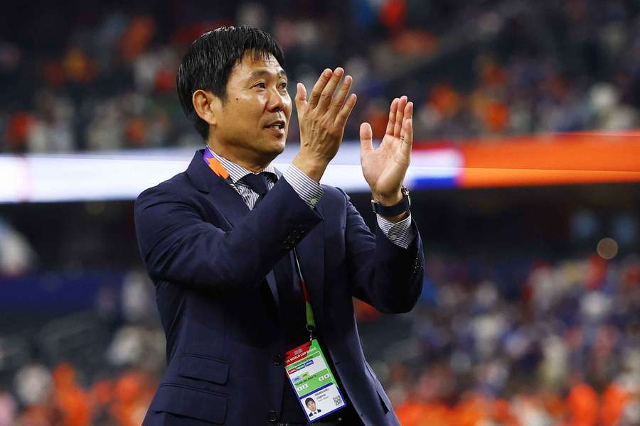 Japan coach Hajime Moriyasu applauds their fans