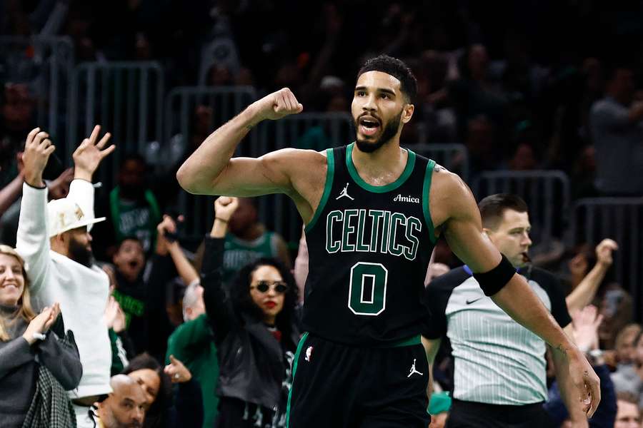 Jayson Tatum pumps up the load Boston crowd as the Celtics deal the Cavs their first loss of the season, ending their 15-game winning streak. 