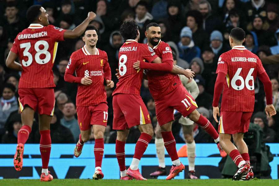 Liverpool players celebrate their second goal in a 2-0 victory over Manchester City at the Etihad Stadium