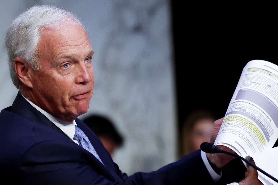 U.S. Senator Ron Johnson (R-WI) holds up redacted documents about 9/11