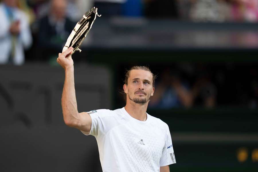 Zverev holds up the finalist trophy Zverev holds up the finalist trophy