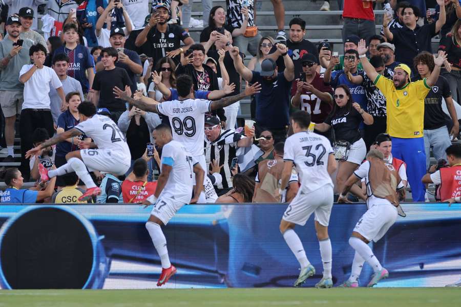 Botafogo's players celebrate against PSG