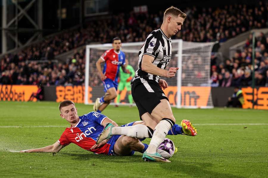 Wharton (L) gets stuck in against Newcastle