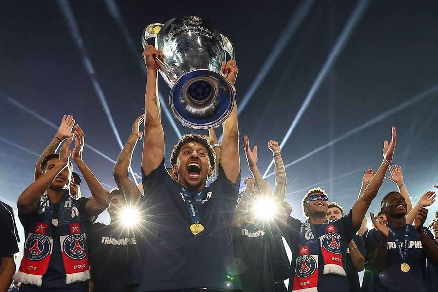 Marquinhos lifts the trophy the day after their win