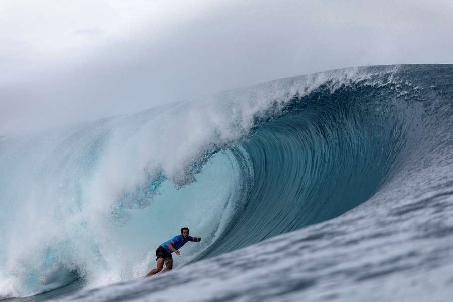 Ramzi Boukhiam of Morocco rides a wave