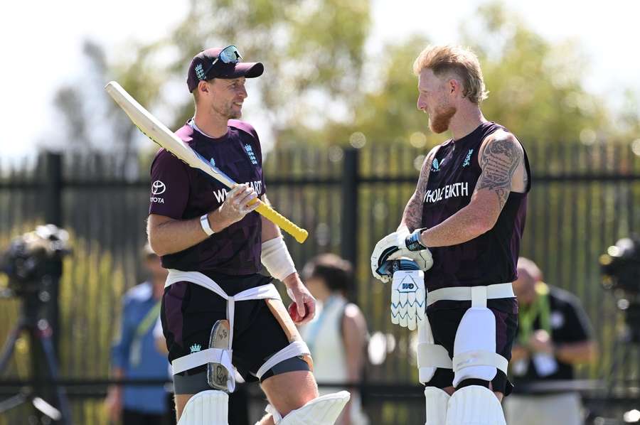 Stokes (R) chats with Joe Root