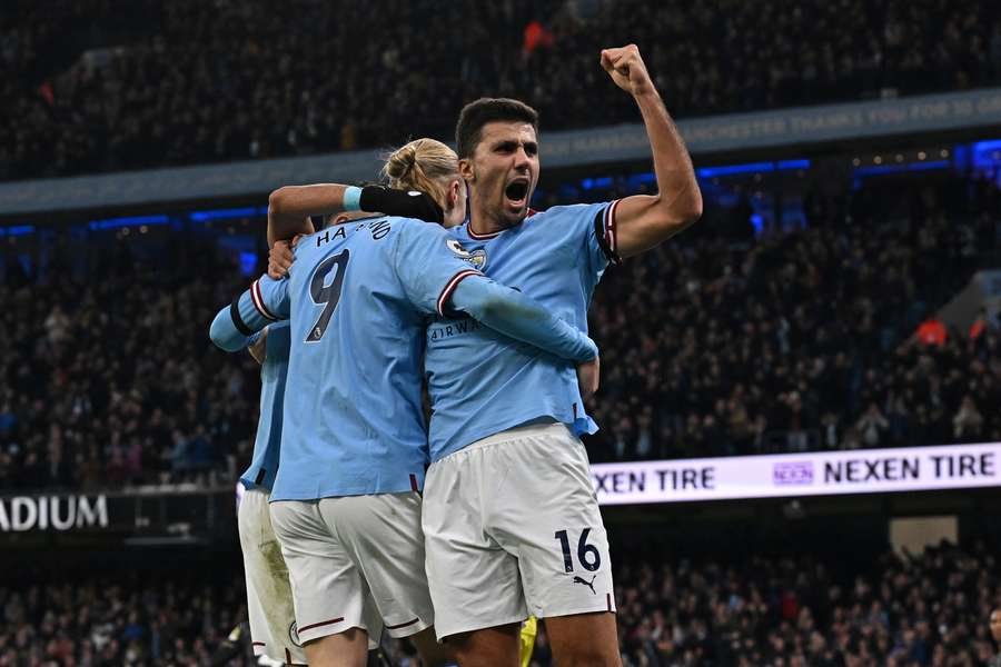 Manchester City's Rodri (R) celebrates with Erling Haaland