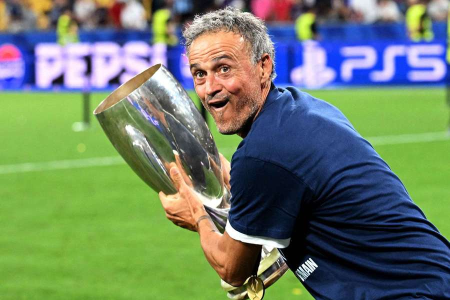 Paris Saint-Germain coach Luis Enrique celebrates with the trophy after winning the UEFA Super Cup Paris Saint-Germain coach Luis Enrique celebrates with the trophy after winning the UEFA Super Cup