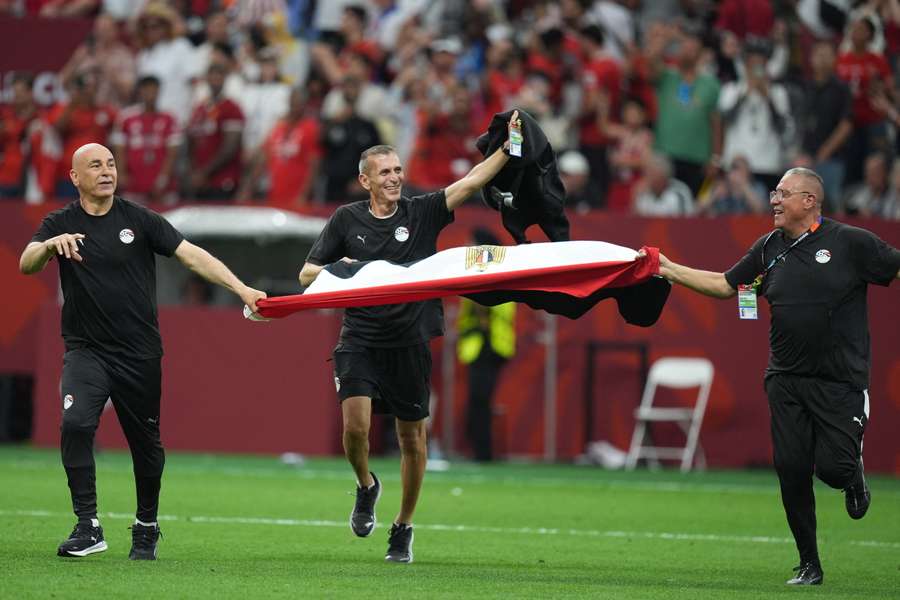 Egypt head coach Hossam Hassan (left) celebrates win over New Zealand