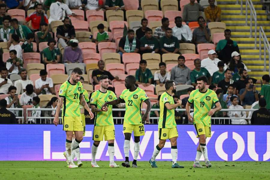 Australia's players celebrate Mitch Duke's winner