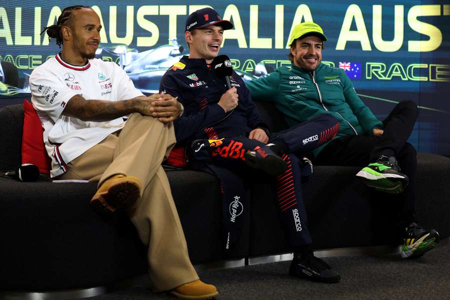 Verstappen (C) sits alongside Hamilton (L) and Fernando Alonso