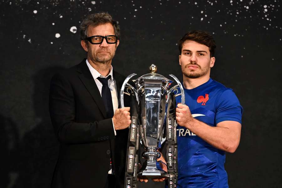 France's head coach Fabien Galthie and France's captain Antoine Dupont hold the Six Nations trophy at the tournament media launch