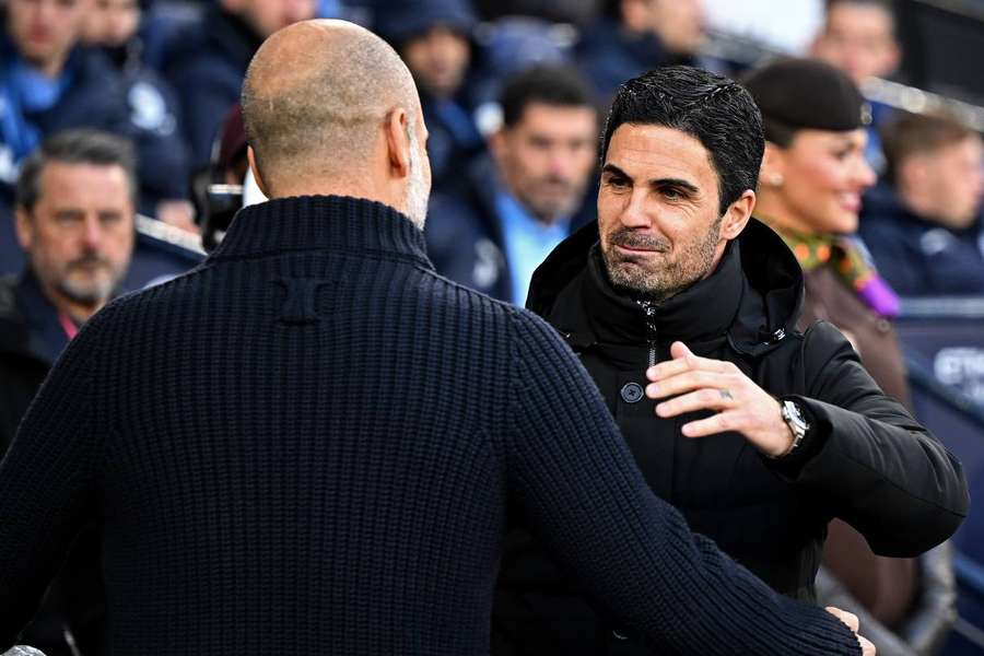 Arsenal's Mikel Arteta greets Man City manager Pep Guardiola before their top of the table clash at the Etihad last week