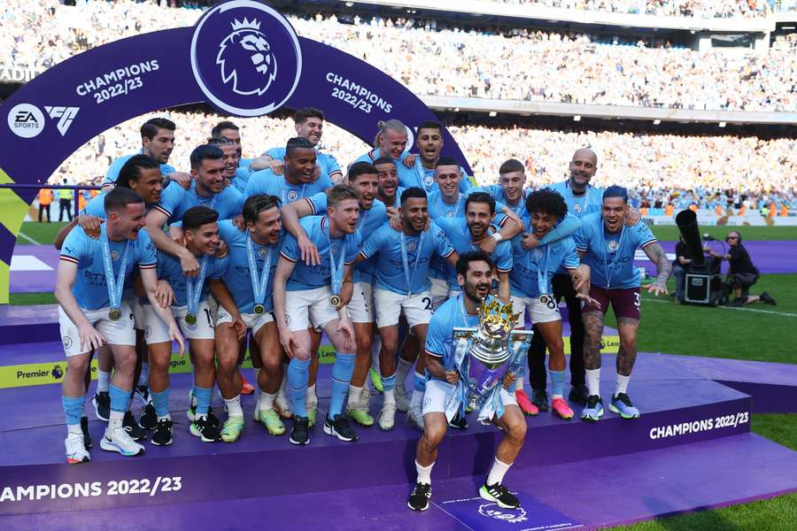 Ilkay Gundogan lifts the Premier League title as Manchester City captain