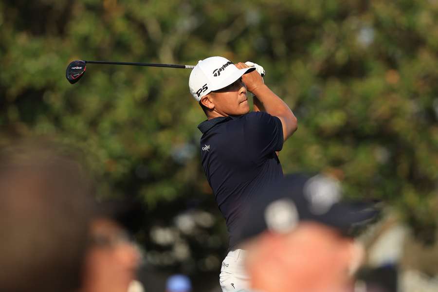Kurt Kitayama of the United States plays his shot