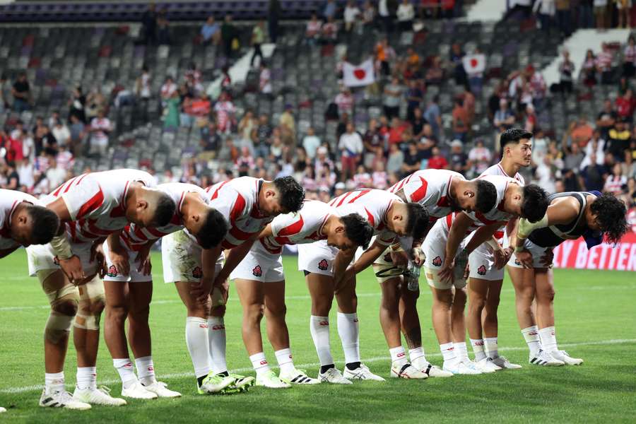 Japan's players bow towards the crowd at the end of the France 2023 Rugby World Cup Pool D match between Japan and Samoa