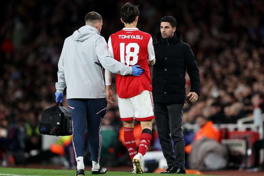 Arsenal manager Mikel Arteta consoles Takehiro Tomiyasu in last week's Europa League game