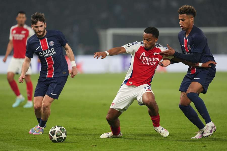 Arsenal's Jurrien Timber holds off PSG duo Desire Doue and Khvicha Kvaratskhelia during the Champions League, Semi Final, Second Leg Arsenal's Jurrien Timber holds off PSG duo Desire Doue and Khvicha Kvaratskhelia during the Champions League, Semi Final, Second Leg