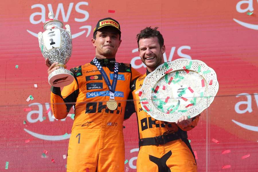 McLaren's Lando Norris (left) celebrates with the trophy on the podium after winning the Hungarian Grand Prix
McLaren's Lando Norris (left) celebrates with the trophy on the podium after winning the Hungarian Grand Prix
