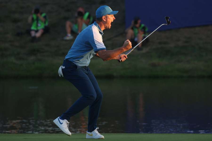 Justin Rose screams in delight after securing a half-point late in the day for Europe