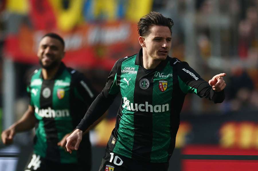 Lens' Florian Thauvin celebrates scoring against Metz Lens' Florian Thauvin celebrates scoring against Metz