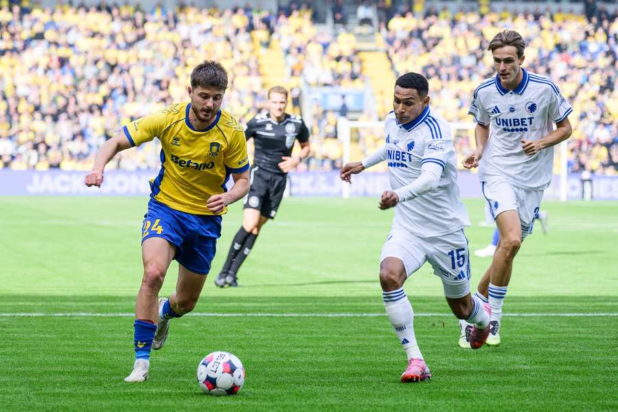 Brondby's Marko Divkovic and FC Copenhagen's Marcos Lopez tussle for the ball
