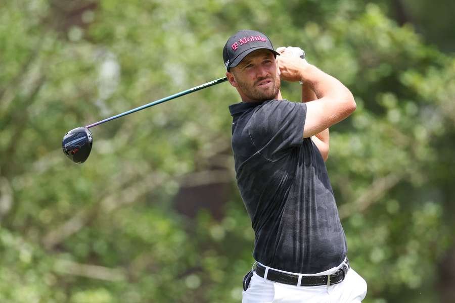 Wyndham Clark of the United States plays his shot from the 11th tee during a practice round