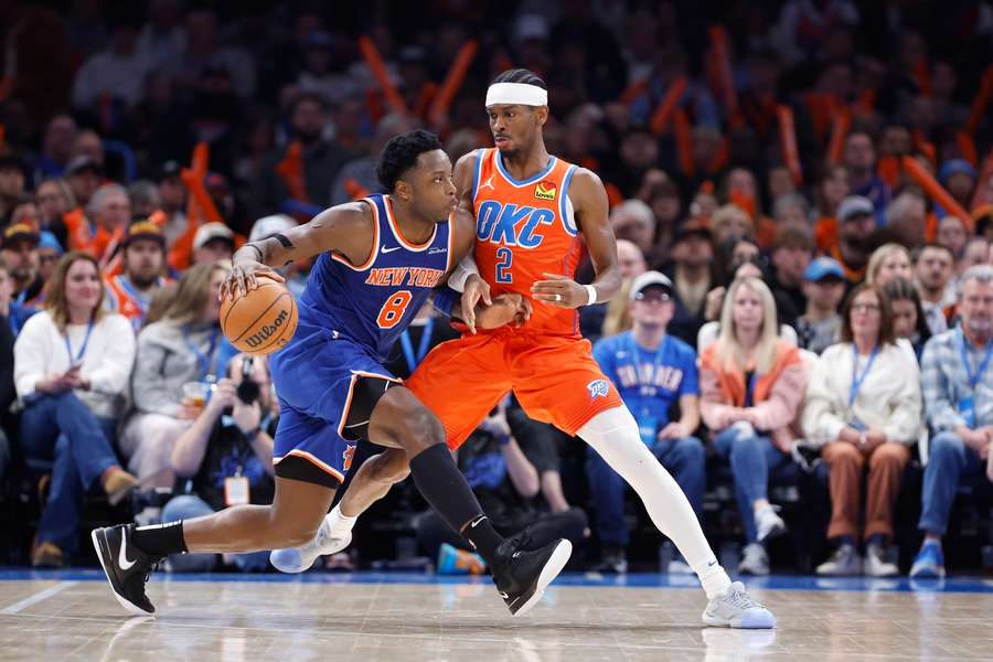 New York Knicks forward OG Anunoby drives to the basket against Oklahoma City Thunder guard Shai Gilgeous-Alexander