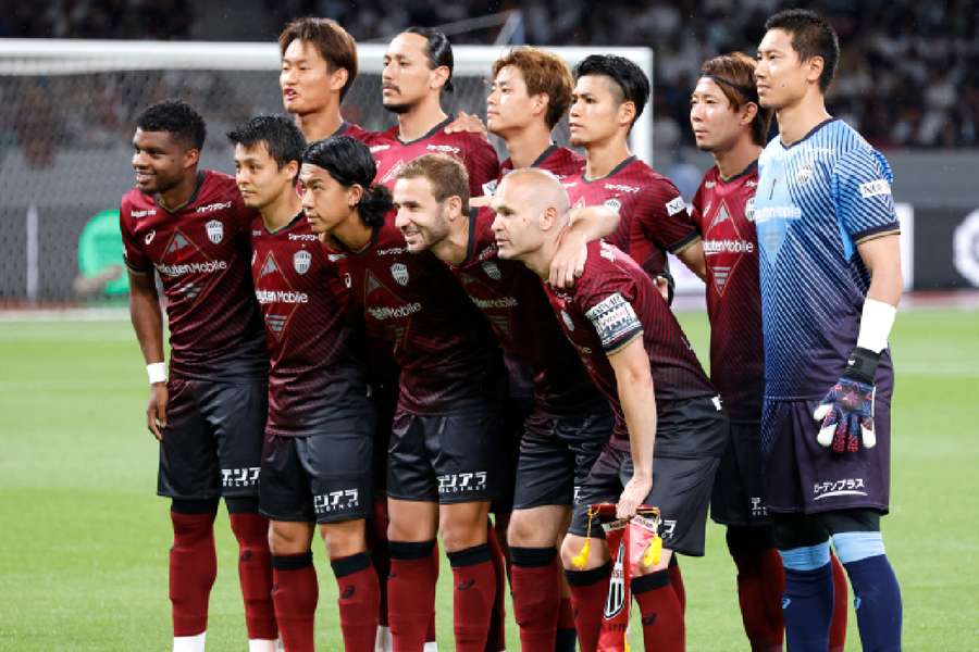 Vissel Kobe players pose for a team group photo before the match