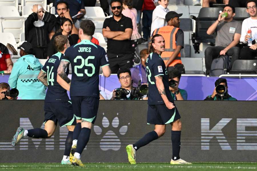 Jackson Irvine (R) celebrates his goal