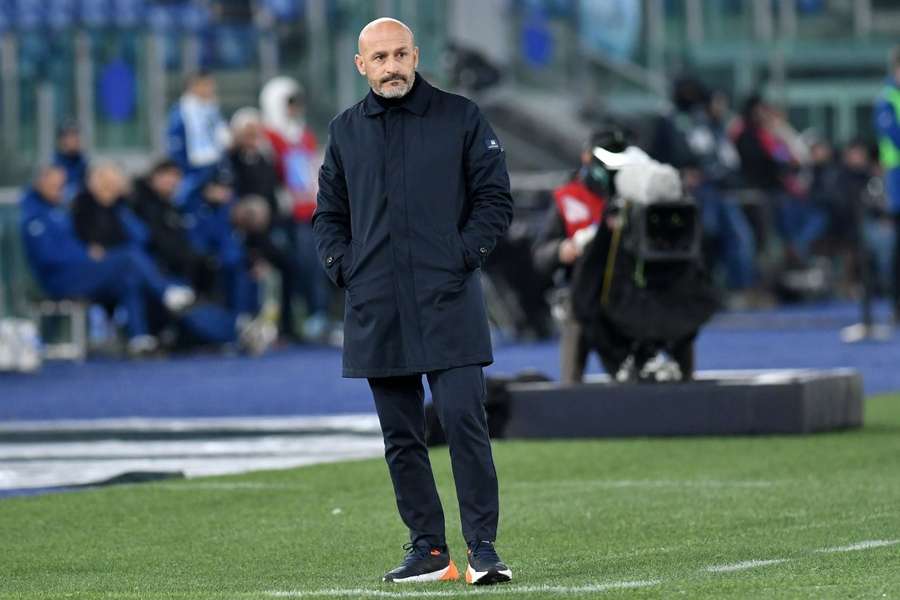 Roma players stand dejected at the end of the match