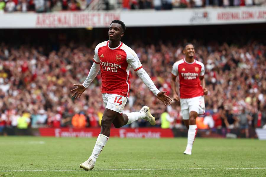 Arsenal's English striker #14 Eddie Nketiah celebrates scoring the opening goal