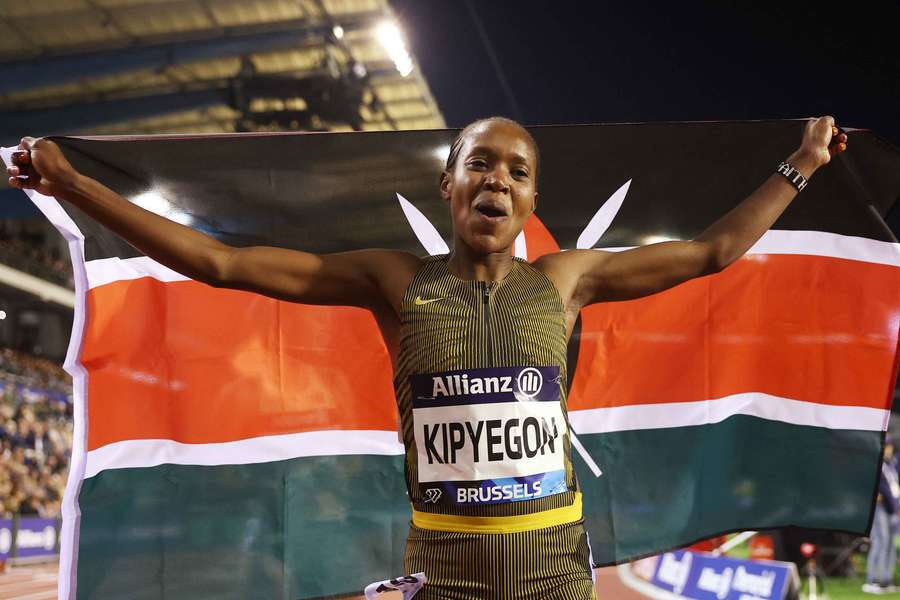 Faith Kipyegon of Kenya celebrates after winning the Women's 1,500m final