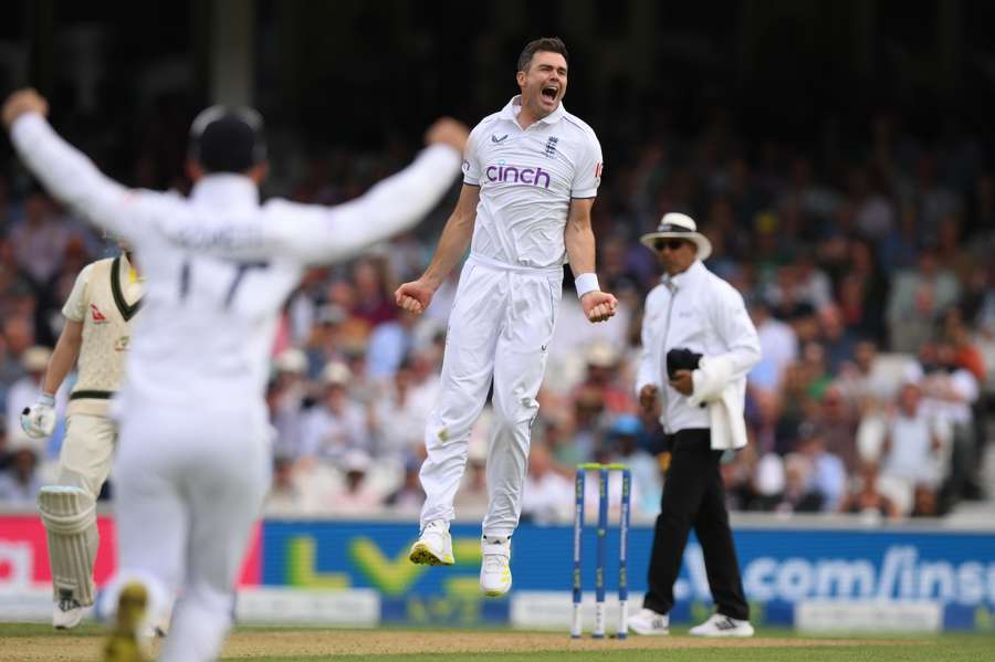 England's James Anderson (C) celebrates after bowling Australia's Mitchell Marsh