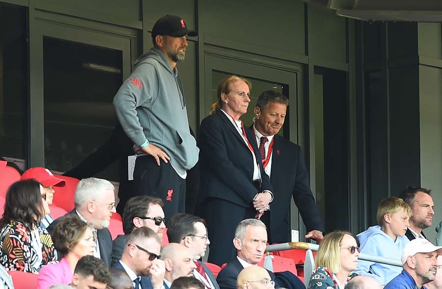 Liverpool's German manager Jurgen Klopp (centre L) watches from the stands during the English Premier League football match between Liverpool and Aston Villa