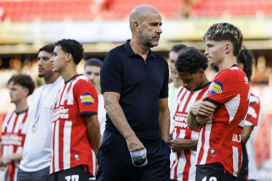 Peter Bosz walks off with his silver medal following PSV's loss to AZ