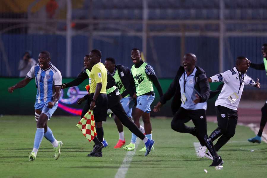 Botswana's Tumisang Orebonye celebrates with teammates and coaches after the match after qualifying for the 2025 African Cup of Nations